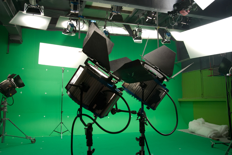 Image of a chroma key studio with green screen and lights